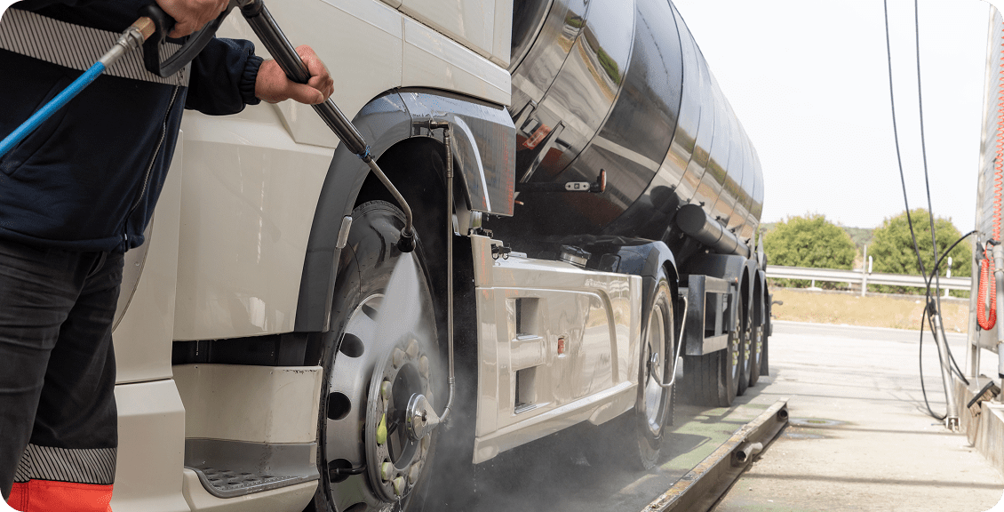 Truck being washed with high-pressure hose